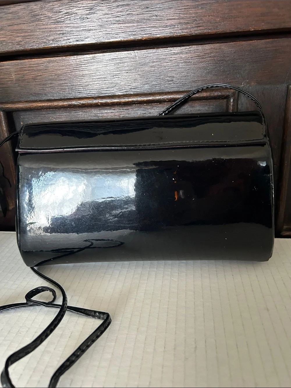 Ande Sleek Black Patent Crossbody with Gold Accent